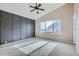 Bedroom featuring a dark accent wall, vaulted ceiling, and carpeted floor at 4296 Clover Ln, Brighton, CO 80601