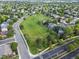 Aerial view of the community park with soccer field, trees, walking and bike paths at 12695 Wolff St, Broomfield, CO 80020
