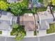 Aerial view of a home with a large roof, landscaped backyard, and driveway at 12695 Wolff St, Broomfield, CO 80020