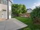 Fenced backyard with grass lawn and a concrete patio at 12695 Wolff St, Broomfield, CO 80020