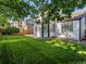 Large, well-maintained grassy backyard with mature trees and new fence at 12695 Wolff St, Broomfield, CO 80020