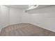Unfurnished basement bedroom featuring neutral carpet and natural light at 12695 Wolff St, Broomfield, CO 80020
