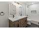 Bathroom with a double sink vanity and modern fixtures at 12695 Wolff St, Broomfield, CO 80020
