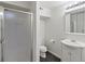 Clean bathroom featuring a shower, toilet, and vanity with storage at 12695 Wolff St, Broomfield, CO 80020