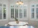 Bright breakfast nook with a round table, elegant lighting, and views from shuttered windows at 12695 Wolff St, Broomfield, CO 80020