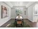 Elegant dining room features hardwood floors, plantation shutters, and stylish decor at 12695 Wolff St, Broomfield, CO 80020