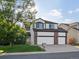 Charming two-story home with a three-car garage and well-manicured lawn at 12695 Wolff St, Broomfield, CO 80020