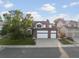 Two-story home with a three-car garage, landscaped yard, and inviting curb appeal at 12695 Wolff St, Broomfield, CO 80020