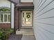 Close up of front door, featuring a wreath, sidelights, and modern hardware at 12695 Wolff St, Broomfield, CO 80020