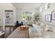 Light filled living room featuring hardwood floors, lots of windows, and a comfortable seating area at 12695 Wolff St, Broomfield, CO 80020