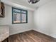 Bright office space with a large window and sleek hardwood flooring at 12695 Wolff St, Broomfield, CO 80020