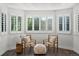 Cozy sitting area with hardwood floors, plantation shutters and comfortable furniture at 12695 Wolff St, Broomfield, CO 80020