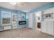 Comfortable bedroom featuring an electric fireplace and built in shelving at 15562 E 109Th Ave, Commerce City, CO 80022