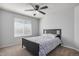 Bedroom with a large window and neutral colors at 15562 E 109Th Ave, Commerce City, CO 80022