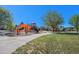 A vibrant community park features playground with climbing structures, swings, and slides in a Gathering-friendly environment at 15562 E 109Th Ave, Commerce City, CO 80022