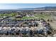 Overhead image capturing the residential area and nearby school against a mountain backdrop at 7019 S Garrison St, Littleton, CO 80128