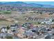 High-angle view of a neighborhood with mountains in the distance, showing community and open land at 7019 S Garrison St, Littleton, CO 80128
