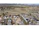 Expansive aerial view showing the neighborhood's layout near open space and mountains in the background at 7019 S Garrison St, Littleton, CO 80128