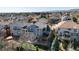 Aerial view of backyard with deck, patio and mature trees, offering privacy and outdoor living space at 7019 S Garrison St, Littleton, CO 80128