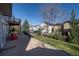 Backyard view showing the deck, patio, lawn, and other homes in the neighborhood at 7019 S Garrison St, Littleton, CO 80128