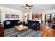 Open-concept living room with hardwood floors, seamlessly connecting to the kitchen and dining areas at 7019 S Garrison St, Littleton, CO 80128