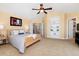 Inviting main bedroom boasts a vaulted ceiling, built-in shelving, and soft, natural light at 7019 S Garrison St, Littleton, CO 80128