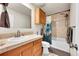 Well-maintained bathroom with shower-tub combo and a vanity with storage at 2281 Coronado Pkwy # D, Denver, CO 80229