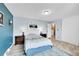 Comfortable bedroom with a blue accent wall, natural light, and a modern design at 2281 Coronado Pkwy # D, Denver, CO 80229