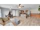 Spacious living area leading to kitchen with breakfast bar island with seating at 2281 Coronado Pkwy # D, Denver, CO 80229