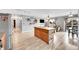 Open floorplan featuring kitchen, dining area, and living room with hardwood floors at 2281 Coronado Pkwy # D, Denver, CO 80229