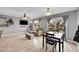 Bright living room featuring hardwood floors, with a window view of the landscape at 2281 Coronado Pkwy # D, Denver, CO 80229