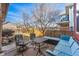 Inviting backyard with stone patio and outdoor seating area, perfect for entertaining at 2853 Yosemite St, Denver, CO 80238