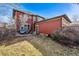 A spacious backyard featuring a seating area and expansive lawn at 2853 Yosemite St, Denver, CO 80238