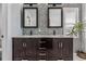 Elegant bathroom features a double vanity, mosaic tile, and a neutral color scheme for a soothing ambiance at 2853 Yosemite St, Denver, CO 80238