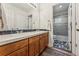 Bathroom featuring double sinks, stylish tiling, and a shower/tub combination at 2853 Yosemite St, Denver, CO 80238