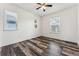 Bedroom featuring a modern ceiling fan and beautiful dark wood laminate flooring at 2853 Yosemite St, Denver, CO 80238