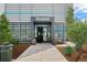 Attractive building entrance of FlyteCo Tower with modern design, barrel accents, and landscaped features at 2853 Yosemite St, Denver, CO 80238