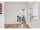 Bright entryway with hardwood floors, glass paneled doors, and a view into the office at 2853 Yosemite St, Denver, CO 80238