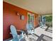 Inviting front porch with comfortable seating, perfect for relaxing outdoors at 2853 Yosemite St, Denver, CO 80238