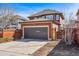 Attached two car garage and driveway provide ample parking for this well-maintained home at 2853 Yosemite St, Denver, CO 80238