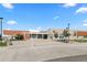 Modern school building with a spacious entrance, landscaped grounds, and ample parking for easy access at 2853 Yosemite St, Denver, CO 80238