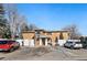 Inviting apartment building with parking in front and a manicured lawn, creating a welcoming curb appeal at 705 S Clinton # 2A, Denver, CO 80247