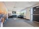 Open office area featuring comfortable seating, a large window, gray carpet, and a view from the entrance door at 1050 S Quitman St, Denver, CO 80219