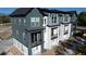 Modern townhome showcasing exterior finishes, balconies, and a landscaped community at 5779 Taft Trl, Arvada, CO 80002