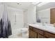 Bathroom featuring shower-tub combo, single sink vanity, and neutral flooring at 14300 E Marina Dr # 512, Aurora, CO 80014