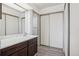 Bathroom featuring modern vanity with marble countertop, large mirrors, and a spacious closet at 14300 E Marina Dr # 512, Aurora, CO 80014