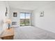 Bedroom with carpeted flooring and sliding glass doors to a balcony with a view at 14300 E Marina Dr # 512, Aurora, CO 80014