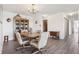 Dining room featuring wood table and wood china cabinet, with vinyl flooring at 14300 E Marina Dr # 512, Aurora, CO 80014