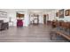 Expansive living space featuring wood-style flooring, dining area, and an open layout at 14300 E Marina Dr # 512, Aurora, CO 80014