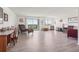 Sunlit living room with a chaise lounge, sliding glass doors to balcony, and neutral decor at 14300 E Marina Dr # 512, Aurora, CO 80014